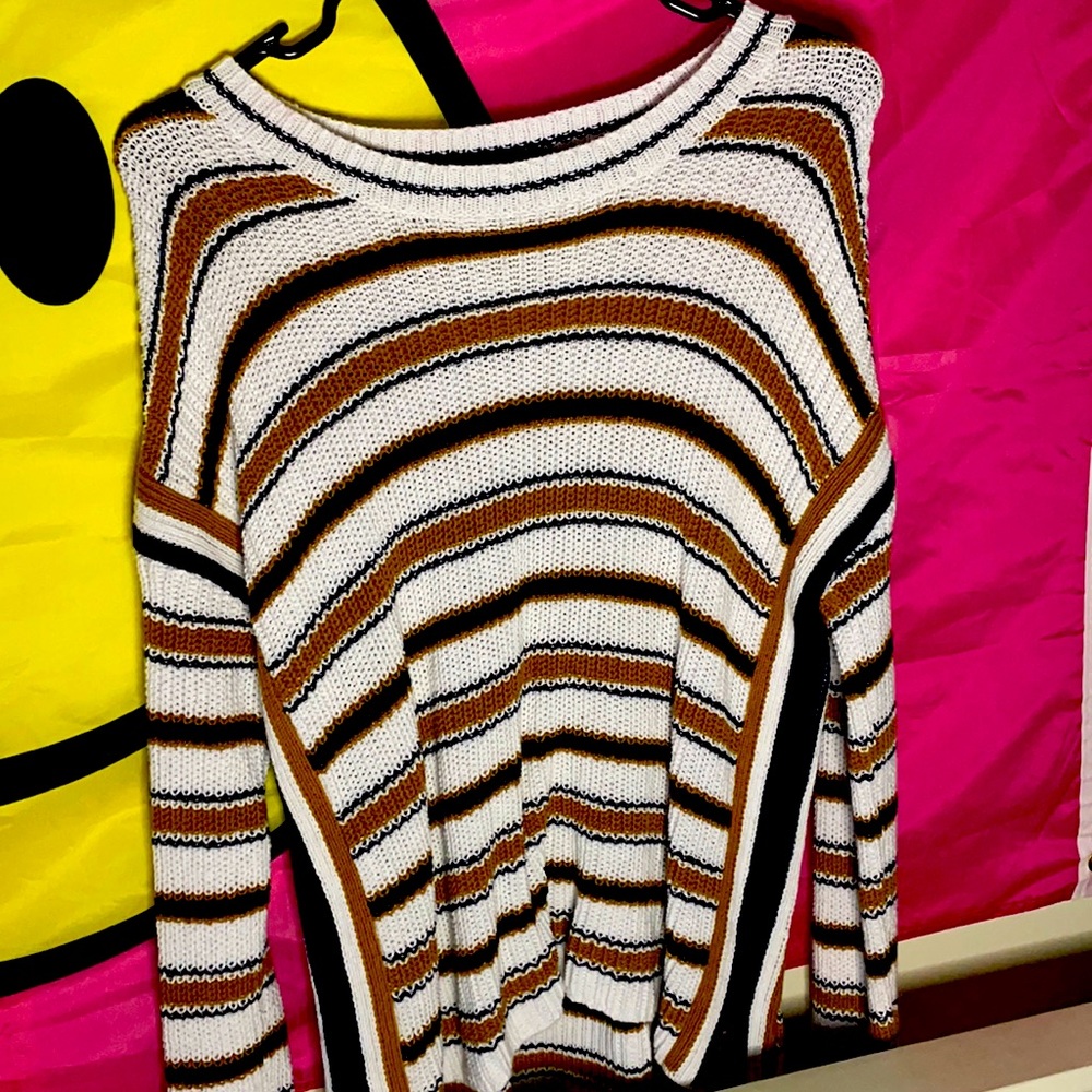 A Max studio sweater a little hole up toward the shoulder